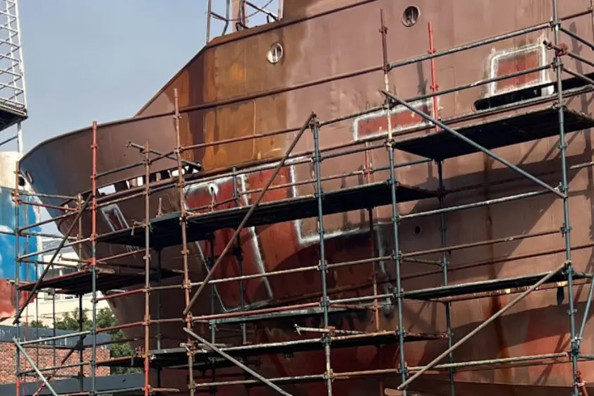 Hull plate inserts and access scaffolding during vessel repair