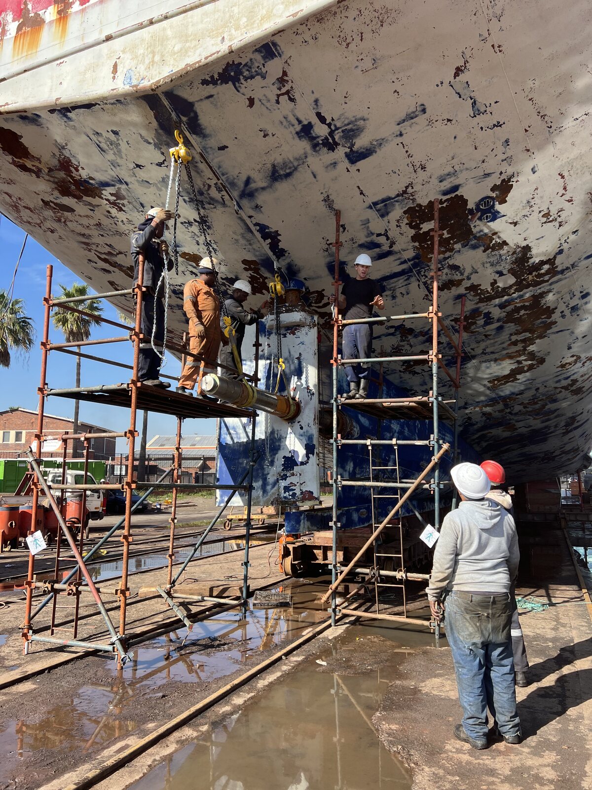 Mechanical team working beneath the vessel